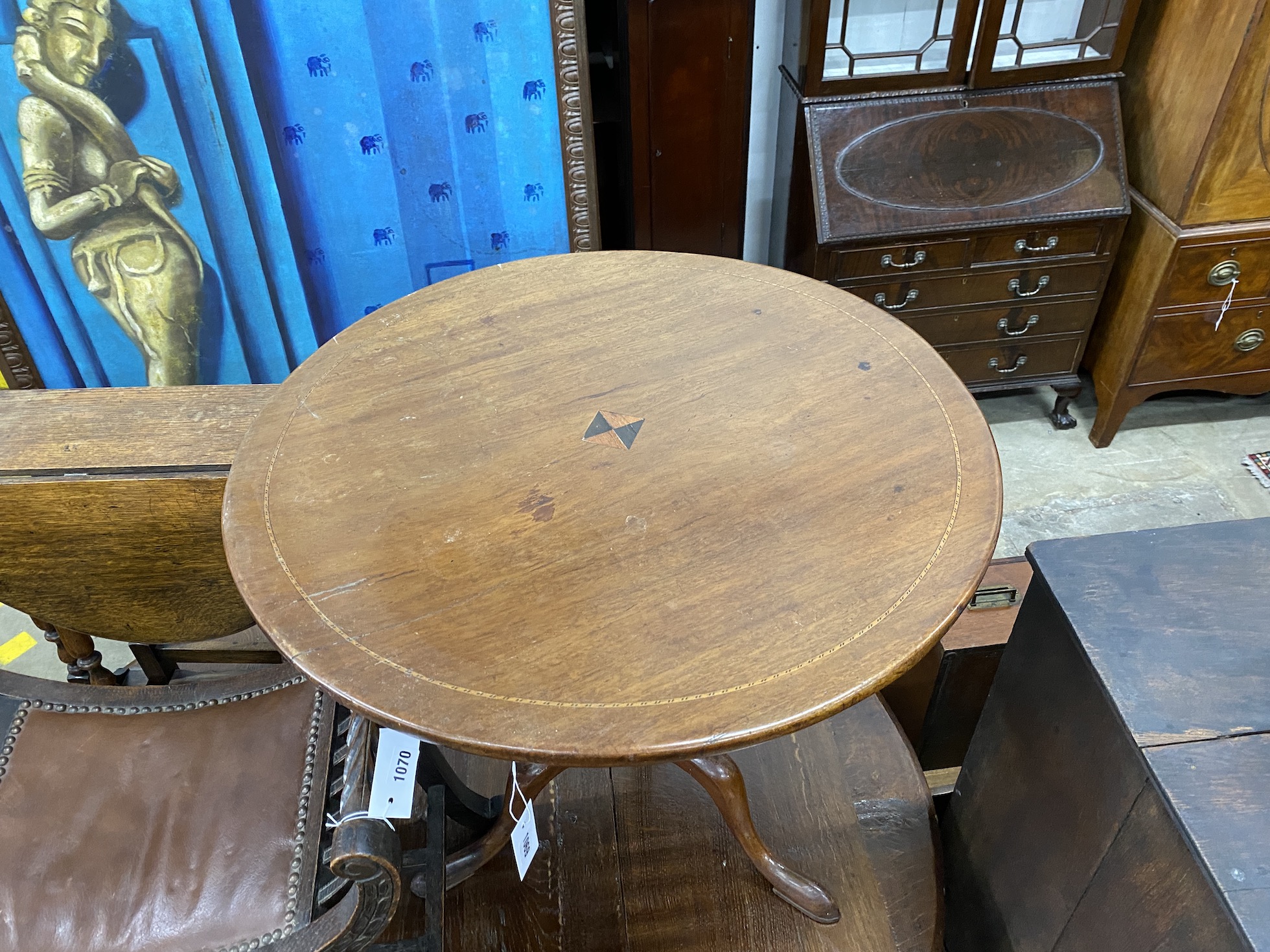 A George III circular mahogany tilt top tea table, diameter, 76cm, height 69cm